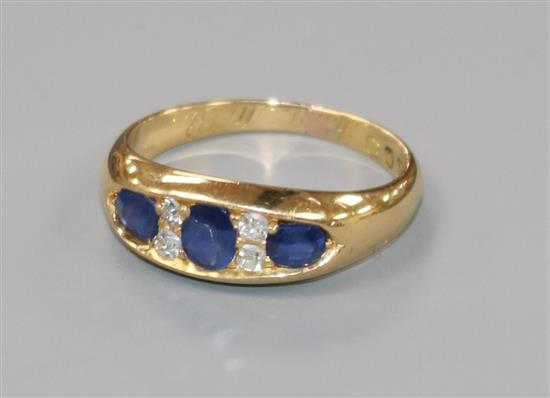 A late Victorian 18ct gold, sapphire and diamond ring, size M.